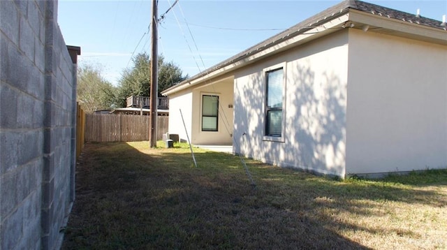 view of property exterior with a lawn