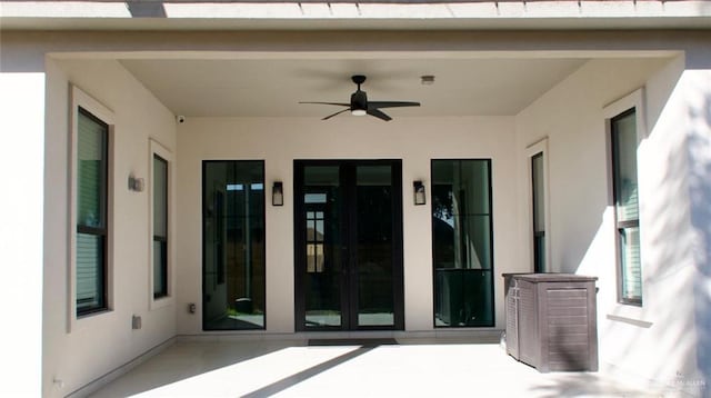 view of patio featuring ceiling fan