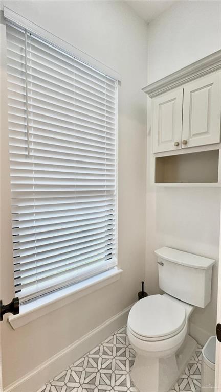 bathroom with tile patterned floors and toilet