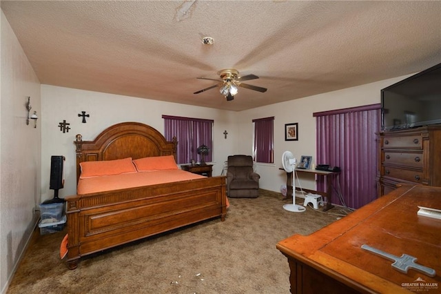 bedroom featuring ceiling fan, carpet, and a textured ceiling