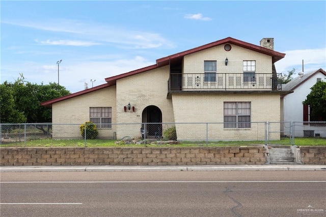 view of front of home with a balcony