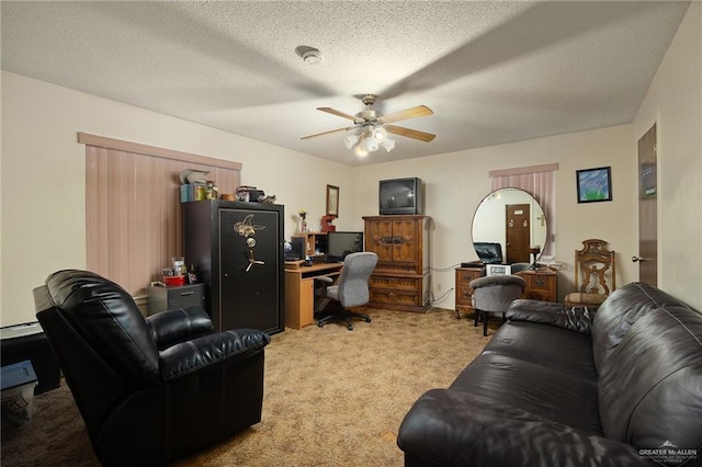 office with ceiling fan, light colored carpet, a textured ceiling, and a baseboard heating unit