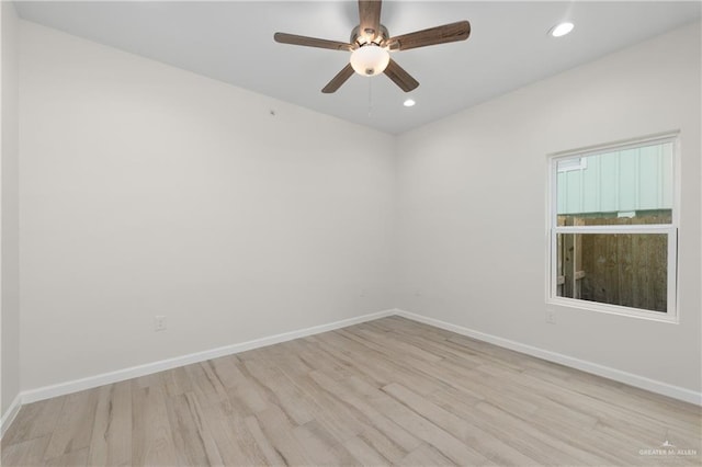 empty room featuring ceiling fan and light wood-type flooring