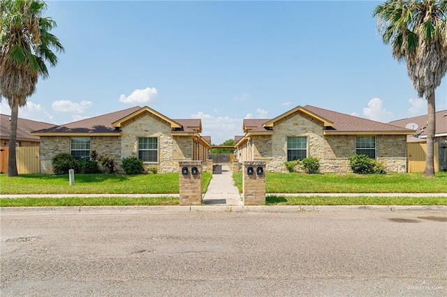 ranch-style home with a front yard