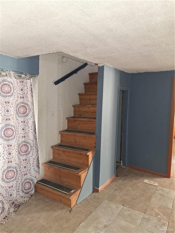 2044 Balboa Ave, Mcallen, TX 78503 - stairs with a textured ceiling