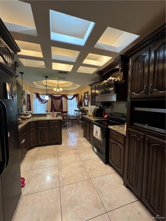 kitchen featuring coffered ceiling, dark brown cabinets, black appliances, decorative light fixtures, and a chandelier