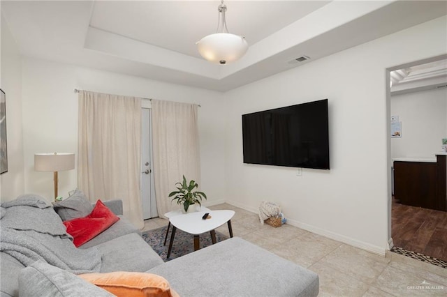 425 E Nebraska Rd, Alamo, TX 78516 - living area featuring baseboards and a raised ceiling
