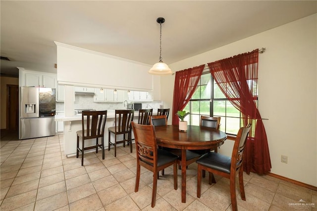 26086 Rabb Rd, La Feria, TX 78559 - dining area with light tile patterned flooring and baseboards