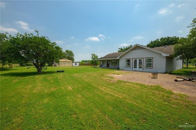 26086 Rabb Rd, La Feria, TX 78559 - view of grassy yard featuring french doors