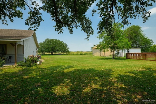 26086 Rabb Rd, La Feria, TX 78559 - view of green lawn featuring a wooden deck