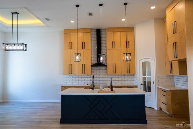 800 W Ruisenor Ave, Pharr, TX 78577 - kitchen with light brown cabinets, light countertops, a kitchen island with sink, tasteful backsplash, and recessed lighting