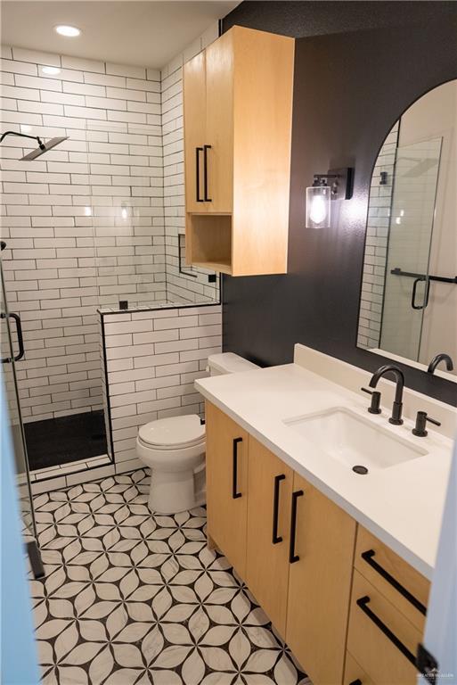 800 W Ruisenor Ave, Pharr, TX 78577 - bathroom featuring vanity, a stall shower, tile patterned floors, and recessed lighting