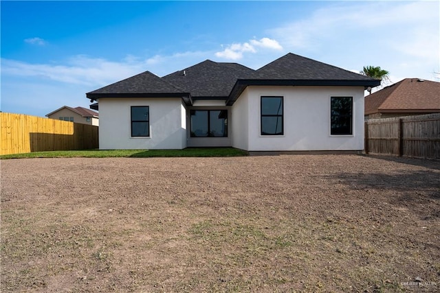 800 W Ruisenor Ave, Pharr, TX 78577 - back of house with stucco siding, a fenced backyard, and a shingled roof
