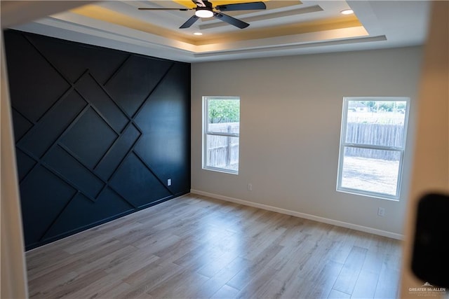 800 W Ruisenor Ave, Pharr, TX 78577 - empty room featuring a raised ceiling, a ceiling fan, wood finished floors, and recessed lighting