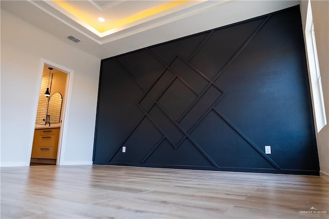 800 W Ruisenor Ave, Pharr, TX 78577 - empty room with wood finished floors and a decorative wall