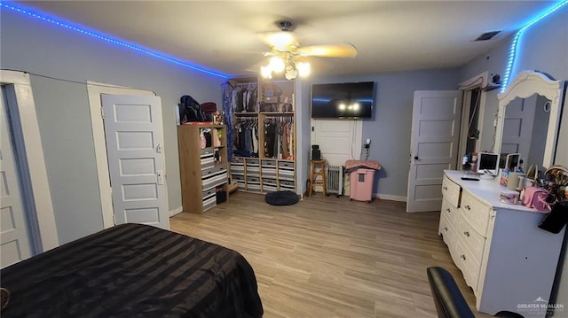 4700 W Mile 4 Rd, Mission, TX 78574 - bedroom with light wood-style flooring and ceiling fan