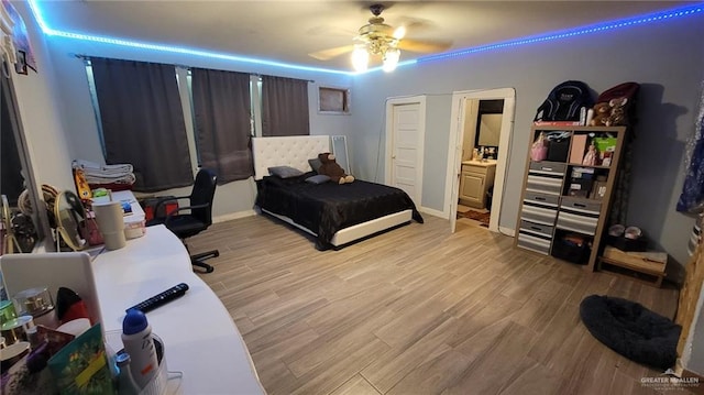 bedroom with ceiling fan and light hardwood / wood-style flooring