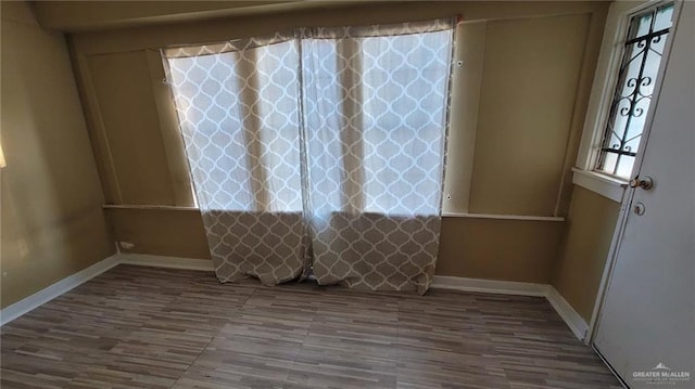 spare room with hardwood / wood-style flooring