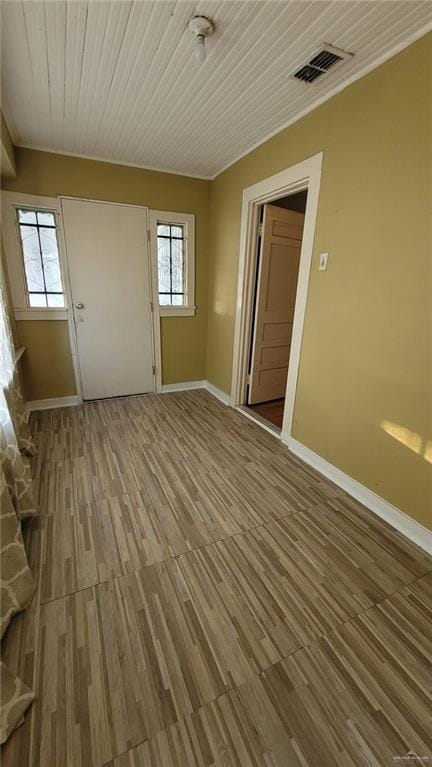 empty room with hardwood / wood-style flooring and wood ceiling