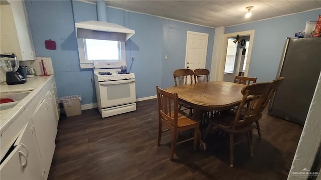 dining area with dark hardwood / wood-style flooring