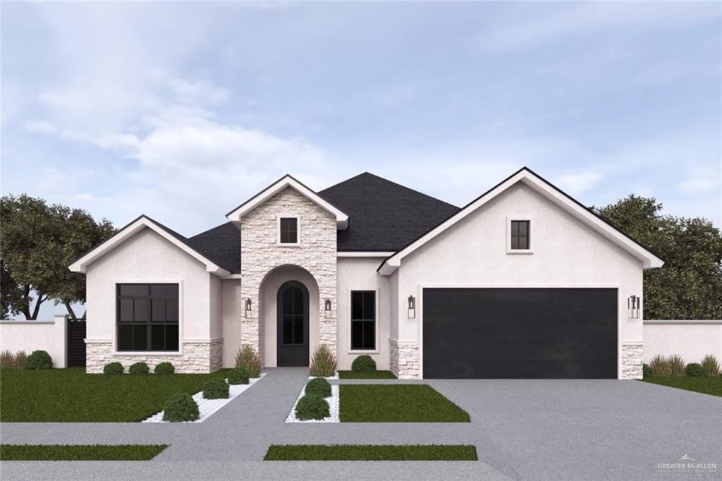 view of front of house with a garage and a front yard