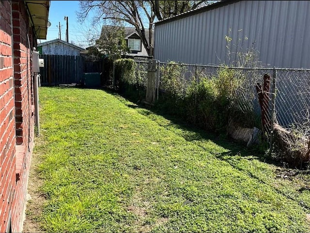 view of yard with a fenced backyard