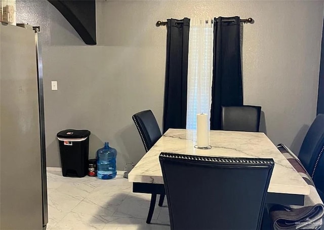 dining area with marble finish floor