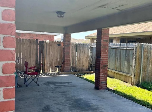 view of patio / terrace featuring fence