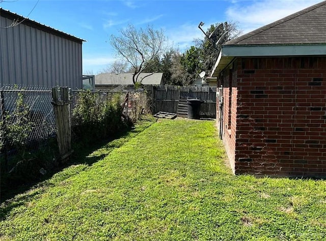 view of yard featuring a fenced backyard