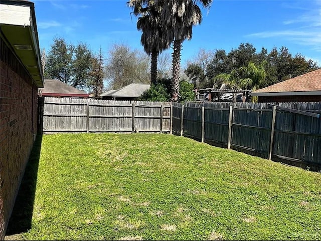 view of yard featuring a fenced backyard