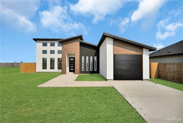 1515 E 32nd St, Hidalgo, TX 78557 - contemporary home with a garage, driveway, and stucco siding