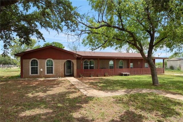 ranch-style house featuring a front lawn