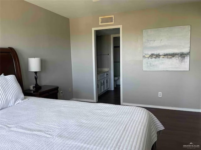 bedroom featuring dark hardwood / wood-style flooring