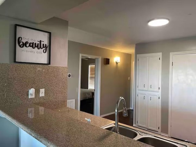 kitchen featuring sink and backsplash