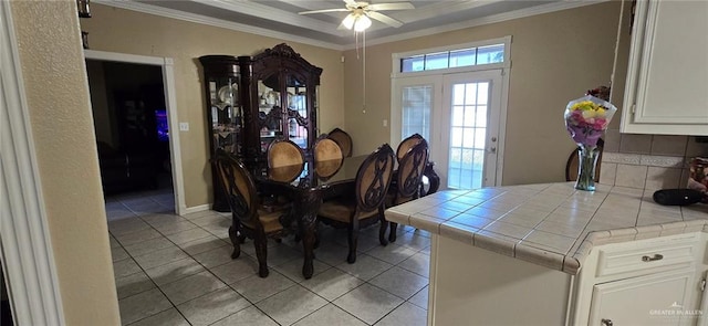 1706 Primrose Ave, Mission, TX 78572 - dining room with light tile patterned floors, crown molding, and a ceiling fan