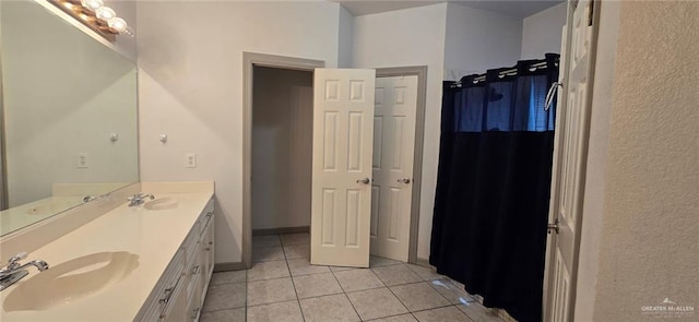 1706 Primrose Ave, Mission, TX 78572 - full bathroom with tile patterned floors and double vanity