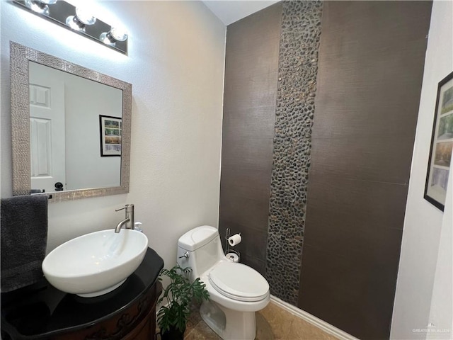 bathroom with toilet and vanity