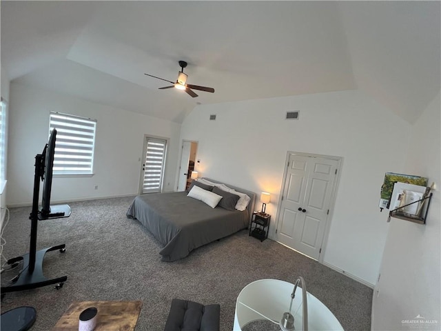 bedroom with lofted ceiling, visible vents, ceiling fan, and carpet