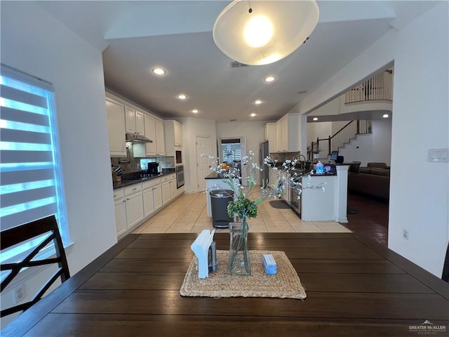 dining space featuring stairway, light tile patterned floors, visible vents, and recessed lighting