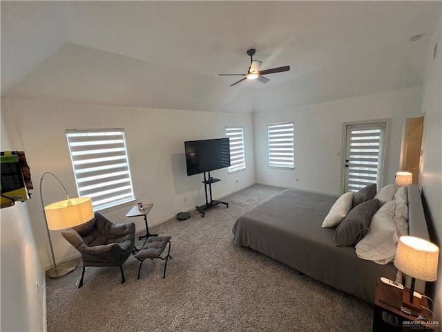 carpeted bedroom with lofted ceiling, baseboards, and ceiling fan