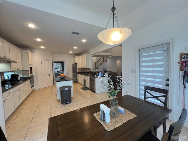 dining space featuring visible vents, recessed lighting, and light tile patterned flooring
