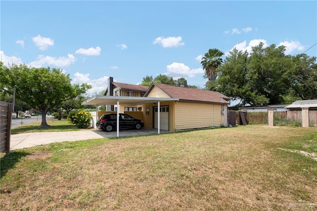 902 N 15th St, Mcallen, TX 78501 - view of home's exterior featuring an attached carport, a yard, and concrete driveway