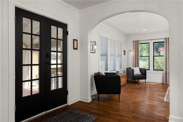 902 N 15th St, Mcallen, TX 78501 - entrance foyer with ornamental molding, arched walkways, wood finished floors, and french doors