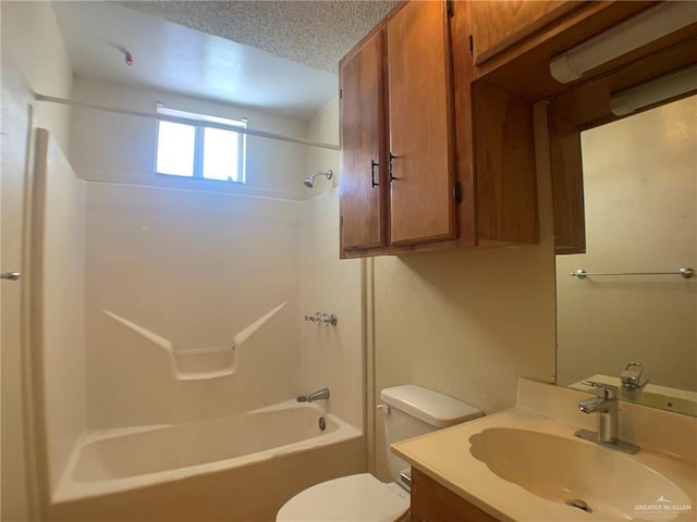 full bathroom with vanity, toilet, shower / bathing tub combination, and a textured ceiling