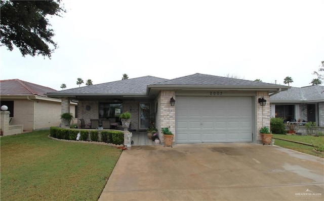 view of front facade with a front yard, a porch, and a garage