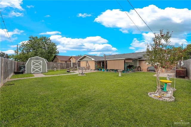 view of yard with a patio area and a storage unit