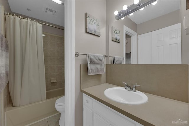 full bathroom featuring toilet, tile patterned flooring, vanity, and shower / tub combo with curtain