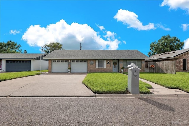 ranch-style home with a garage and a front lawn