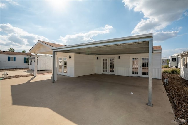 rear view of property featuring french doors