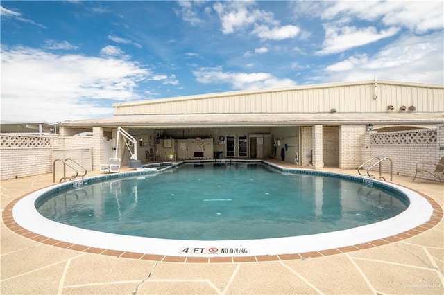 view of pool featuring a patio area